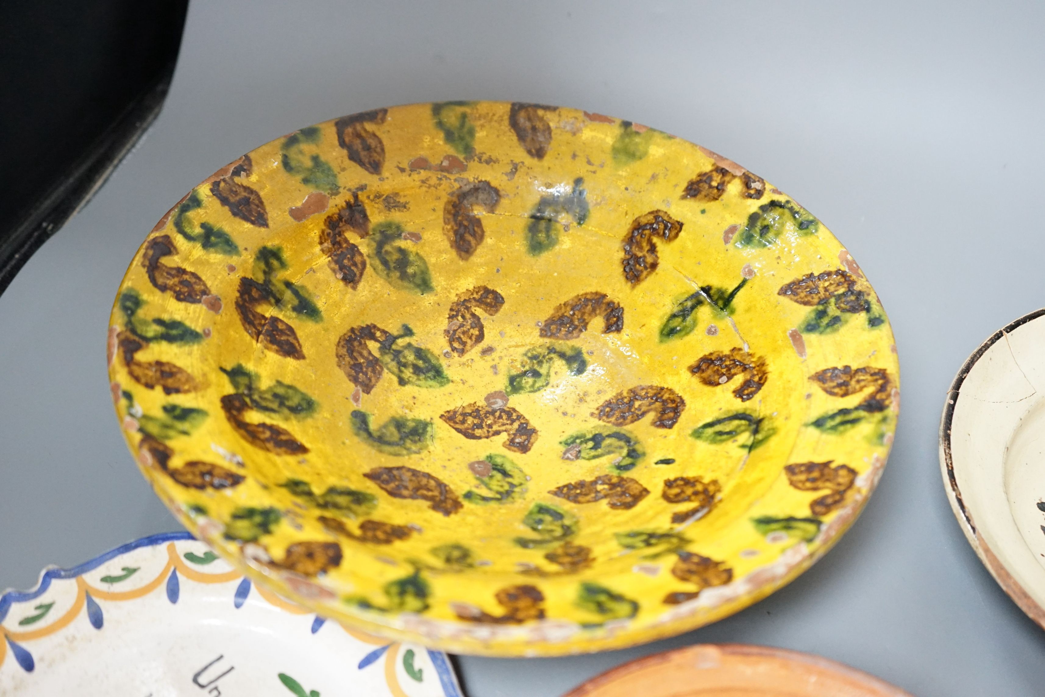 A group of 19th/20th century Continental pottery items to include two sponge ware dishes and a partially glazed jar, largest 20cm, (6)